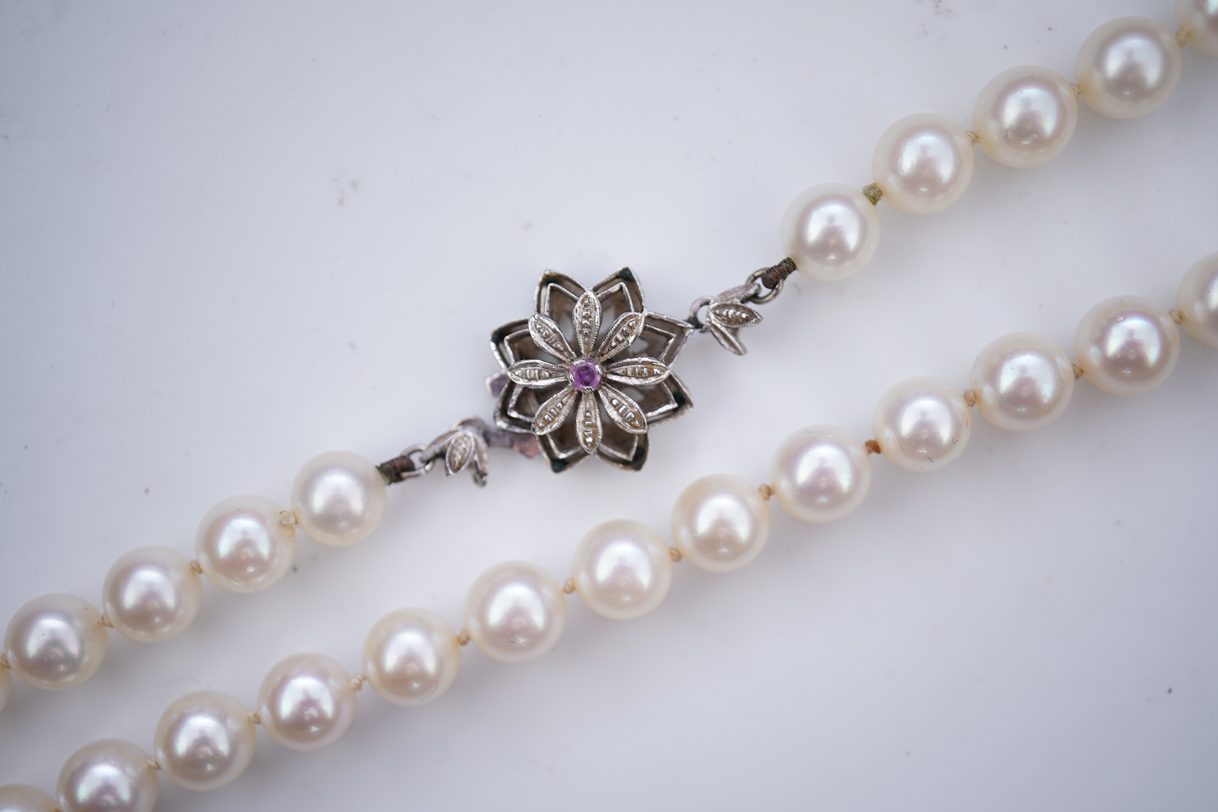 A cultured pearl necklace and pair of mabé cultured pearl ear clips